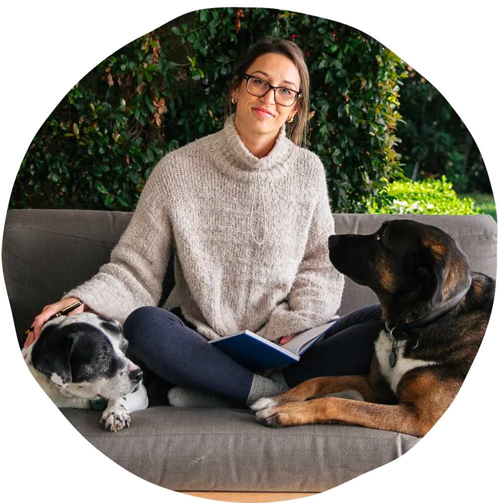 A photo of the CEO and Co-Founder, Terri, with her two dogs.